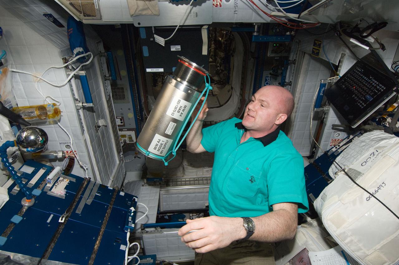 ISS030-E-272061 (17 April 2012) --- European Space Agency astronaut Andre Kuipers, Expedition 30 flight engineer, holds an Intermodular Ventilation (IMV) Supply Duct Jumper in the Harmony node of the International Space Station.