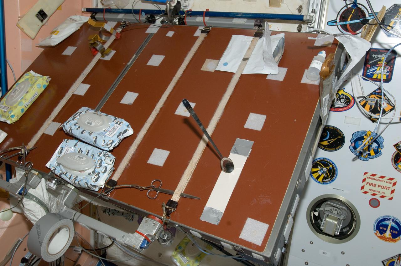 ISS031-E-012220 (5 May 2012) --- A close-up view of the galley in the Unity node photographed by an Expedition 31 crew member on the International Space Station. A long spoon, stuck to double-sided tape is visible in the foreground. This image was used during a Saturday Morning Science session with NASA astronaut Don Pettit, flight engineer.