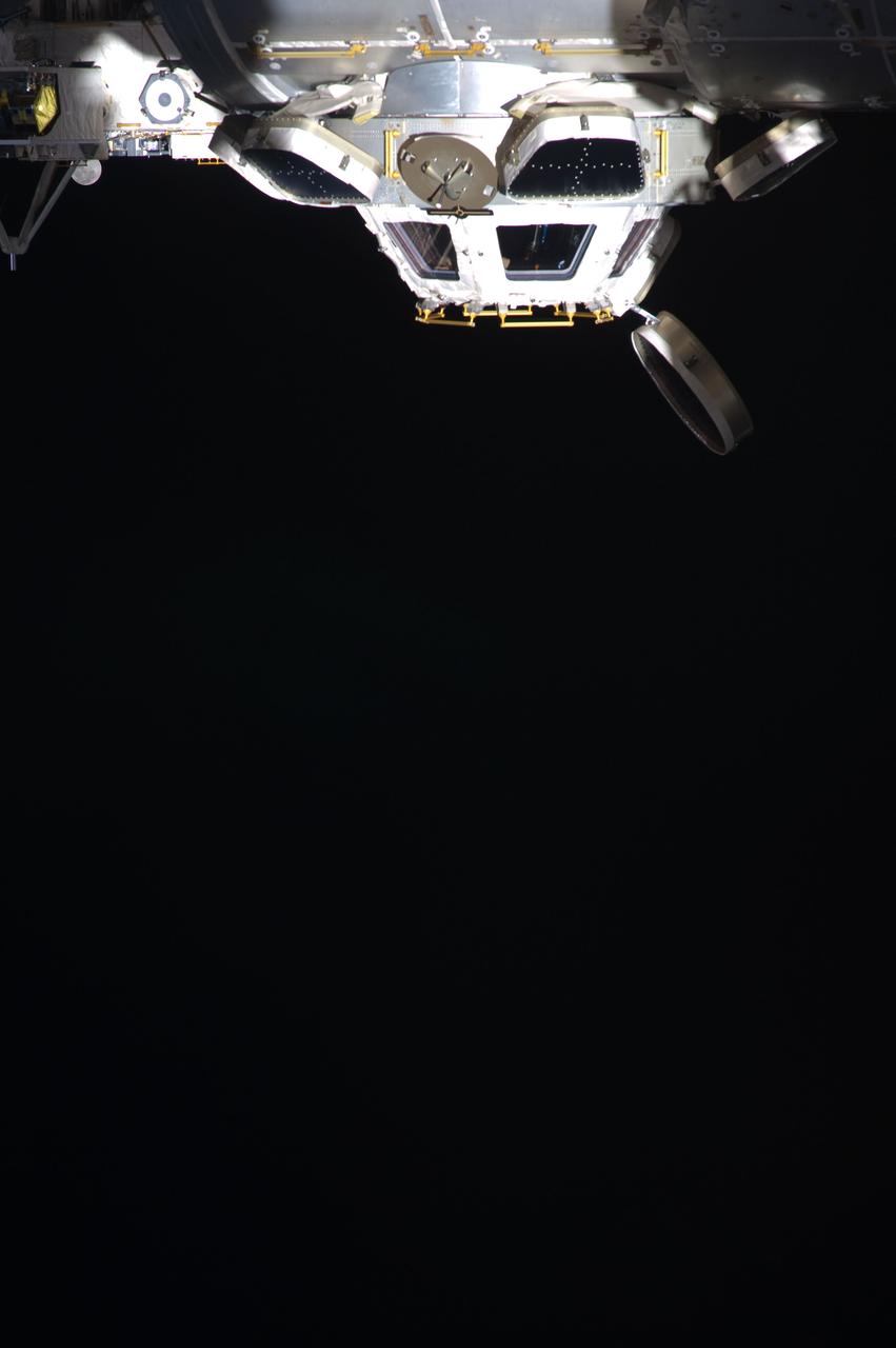 ISS031-E-028009 (6 May 2012) --- The International Space Station's Cupola was photographed in a position that Earth-dwellers refer to as "upside down" in this image photographed by one of the Expedition 31 crew members. The moon is partially obscured by the Japanese Experiment Module's exposed facility  in upper left.