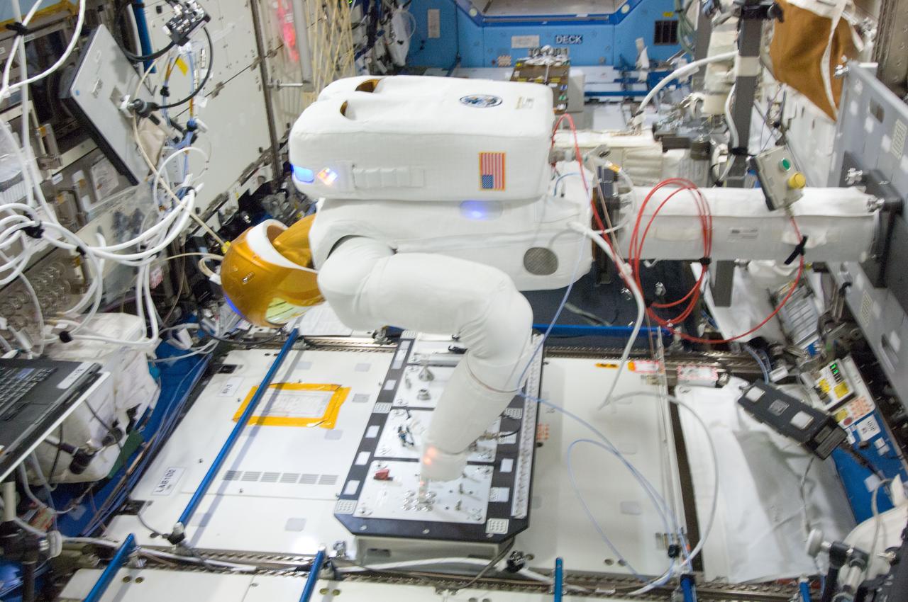 ISS031-E-031704 (1 May 2012) --- Controlled by teams on the ground, Robonaut 2 humanoid robot uses a task board during an arm and finger motions check out in the Destiny laboratory of the International Space Station.