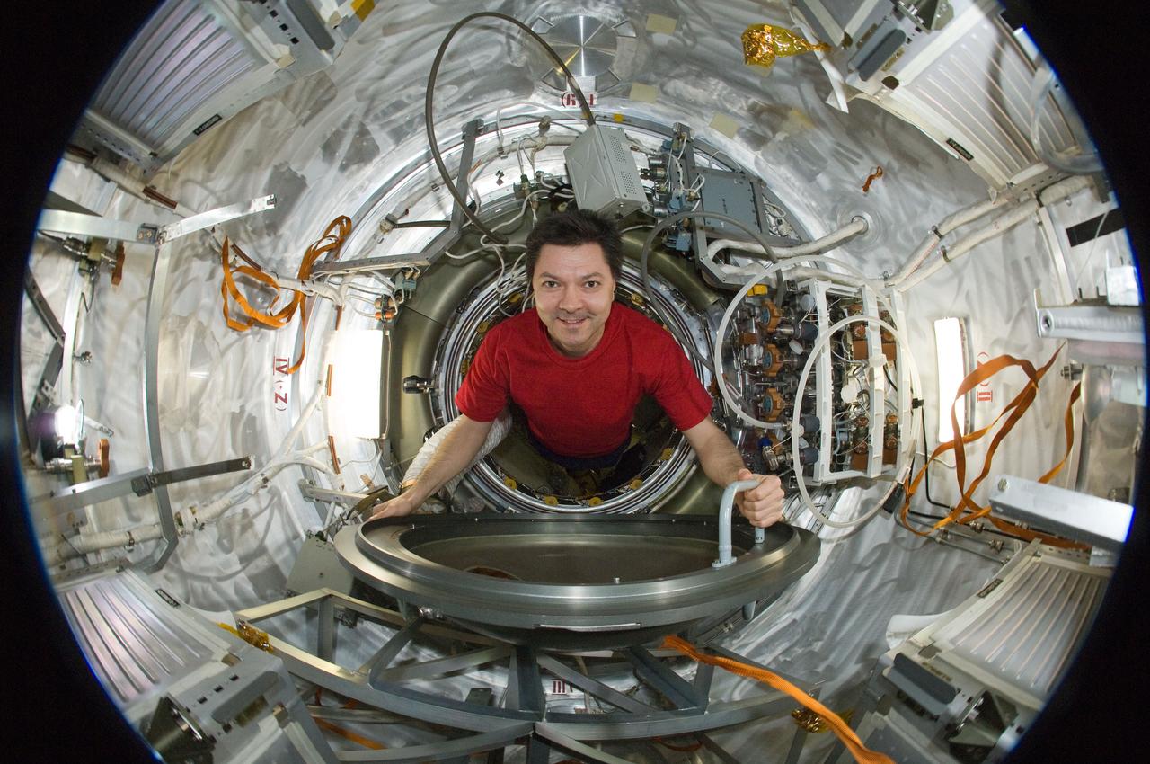 ISS031-E-035440 (15 May 2012) --- A fisheye lens attached to an electronic still camera was used to capture this image of Russian cosmonaut Oleg Kononenko, Expedition 31 commander, in the Progress 47 resupply vehicle docked to the International Space Station’s Pirs Docking Compartment.