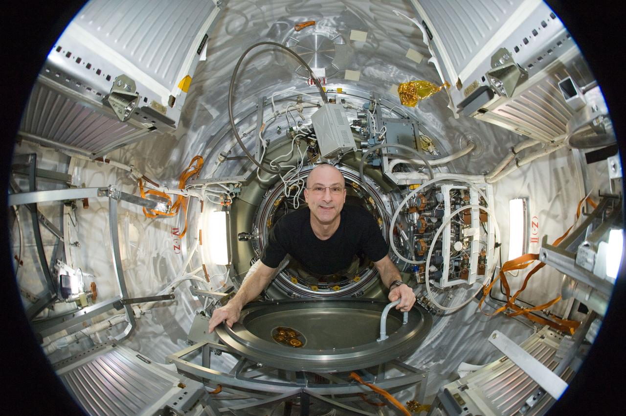 ISS031-E-035441 (15 May 2012) --- A fisheye lens attached to an electronic still camera was used to capture this image of NASA astronaut Don Pettit, Expedition 31 flight engineer, in the Progress 47 resupply vehicle docked to the International Space Station’s Pirs Docking Compartment.