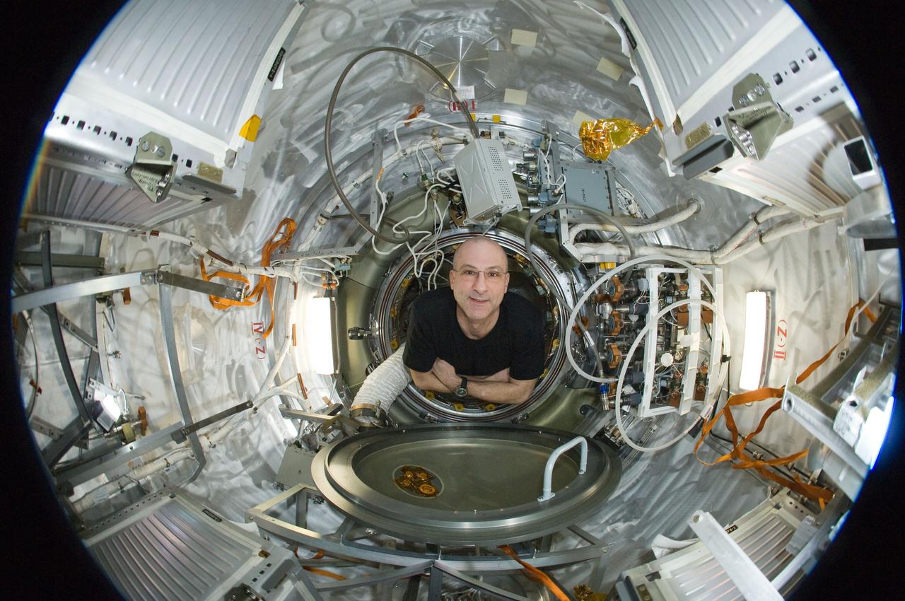 ISS031-E-035443 (15 May 2012) --- A fisheye lens attached to an electronic still camera was used to capture this image of NASA astronaut Don Pettit, Expedition 31 flight engineer, in the Progress 47 resupply vehicle docked to the International Space Station’s Pirs Docking Compartment.