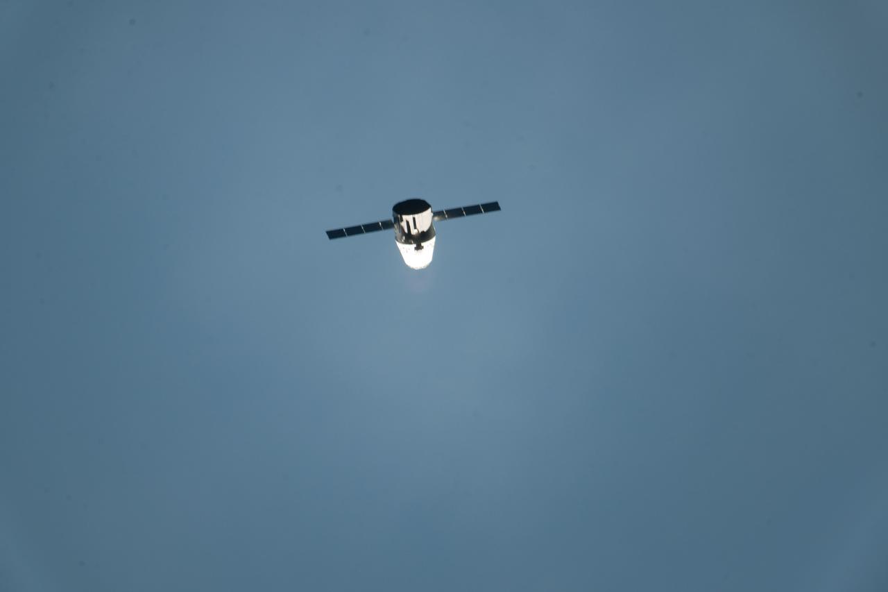 ISS031-E-067345 (24 May 2012) --- The SpaceX Dragon commercial cargo craft approaches the International Space Station on May 24, 2012 for a series of tests to clear it for its final rendezvous and grapple on May 25. At 3:58 a.m. (EDT), Dragon performed a height adjust burn to bring it to a path 2.4 kilometers below the station. During this “fly-under,” Dragon established UHF communication with the station using its Commercial Orbital Transportation Services (COTS) Ultra-high frequency Communication Unit (CUCU). Dragon performed a test of its Relative GPS system, which uses the relative positions of the spacecraft to the space station to determine its location. On May 25, Expedition 31 Flight Engineers Don Pettit and Andre Kuipers will use the Canadarm2 robotic arm to grapple the supply ship about 8:06 a.m., with the berthing to the Earth-facing side of the station’s Harmony node following about 11:20 a.m. Dragon is scheduled to spend about a week docked with the station before returning to Earth on May 31 for retrieval.