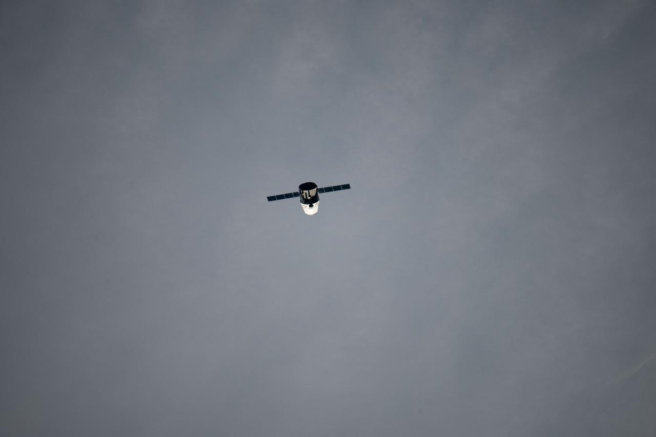 ISS031-E-067404 (24 May 2012) --- The SpaceX Dragon commercial cargo craft approaches the International Space Station on May 24, 2012 for a series of tests to clear it for its final rendezvous and grapple on May 25. At 3:58 a.m. (EDT), Dragon performed a height adjust burn to bring it to a path 2.4 kilometers below the station. During this “fly-under,” Dragon established UHF communication with the station using its Commercial Orbital Transportation Services (COTS) Ultra-high frequency Communication Unit (CUCU). Dragon performed a test of its Relative GPS system, which uses the relative positions of the spacecraft to the space station to determine its location. On May 25, Expedition 31 Flight Engineers Don Pettit and Andre Kuipers will use the Canadarm2 robotic arm to grapple the supply ship about 8:06 a.m., with the berthing to the Earth-facing side of the station’s Harmony node following about 11:20 a.m. Dragon is scheduled to spend about a week docked with the station before returning to Earth on May 31 for retrieval.
