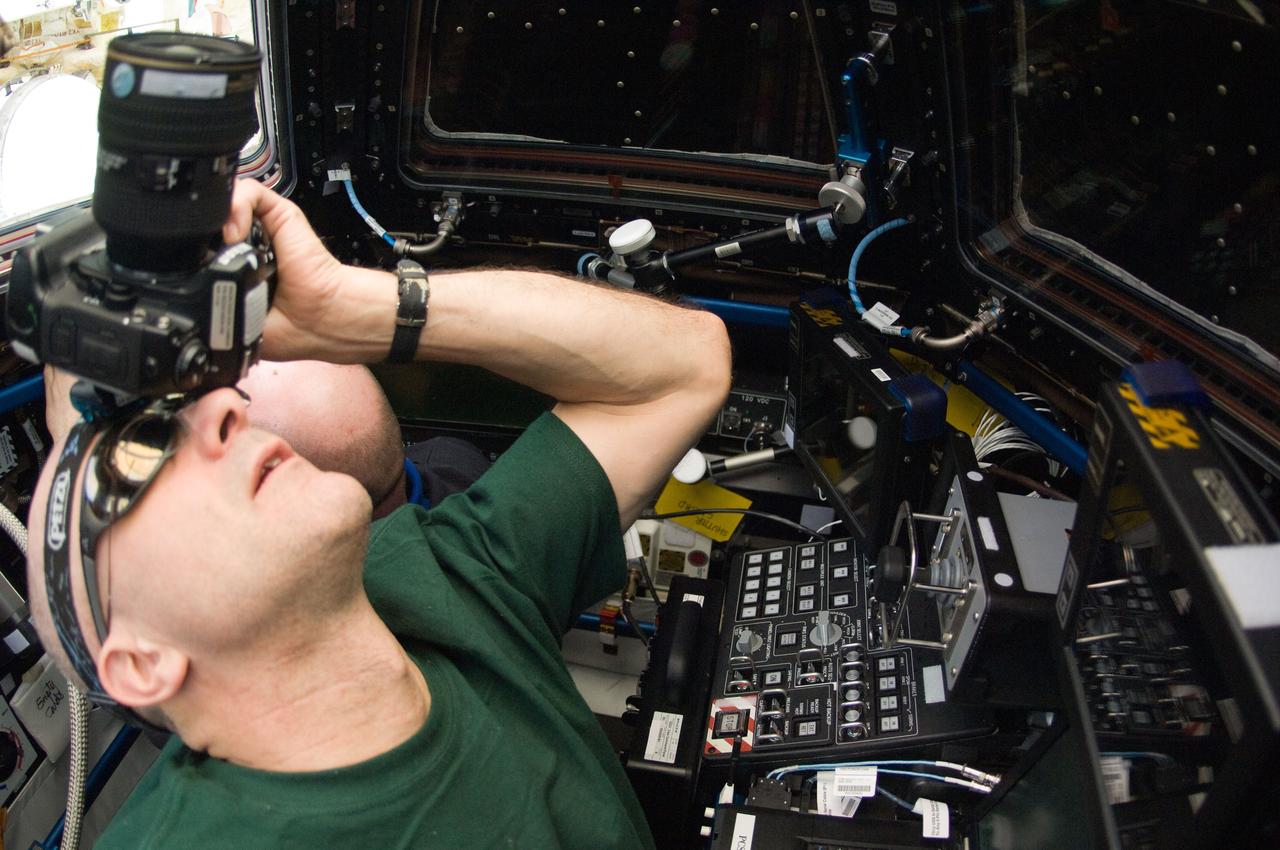 ISS031-E-069294 (24 May 2012) --- NASA astronaut Don Pettit, Expedition 31 flight engineer, takes pictures out one of Cupola windows on the International Space Station while the crew members were preparing for May 25's grapple and berthing of the SpaceX Dragon spacecraft.