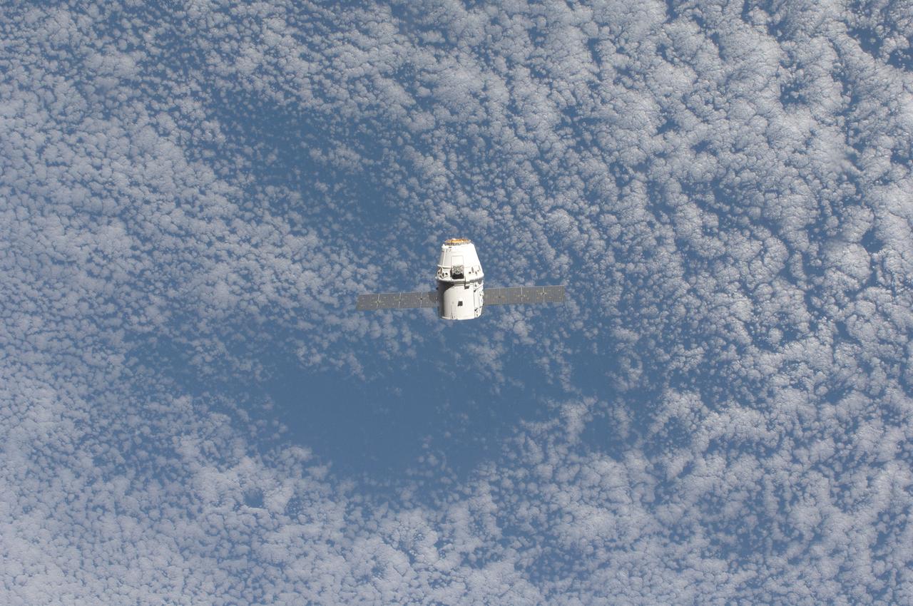 ISS031-E-071075 (25 May 2012) --- The SpaceX Dragon commercial cargo craft approaches the International Space Station on May 25, 2012 for grapple and berthing. Expedition 31 Flight Engineers Don Pettit and Andre Kuipers grappled Dragon at 9:56 a.m. (EDT) with the Canadarm2 robotic arm and used the robotic arm to berth Dragon to the Earth-facing side of the station’s Harmony node at 12:02 p.m. May 25, 2012. Dragon became the first commercially developed space vehicle to be launched to the station to join Russian, European and Japanese resupply craft that service the complex while restoring a U.S. capability to deliver cargo to the orbital laboratory. Dragon is scheduled to spend about a week docked with the station before returning to Earth on May 31 for retrieval.