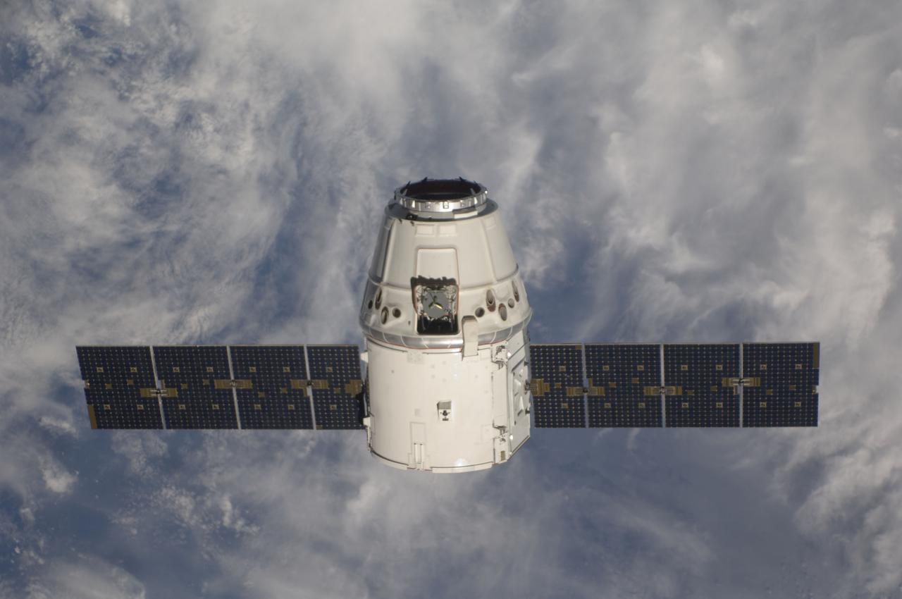 ISS031-E-071135 (25 May 2012) --- The SpaceX Dragon commercial cargo craft approaches the International Space Station on May 25, 2012 for grapple and berthing. Expedition 31 Flight Engineers Don Pettit and Andre Kuipers grappled Dragon at 9:56 a.m. (EDT) with the Canadarm2 robotic arm and used the robotic arm to berth Dragon to the Earth-facing side of the station’s Harmony node at 12:02 p.m. May 25, 2012. Dragon became the first commercially developed space vehicle to be launched to the station to join Russian, European and Japanese resupply craft that service the complex while restoring a U.S. capability to deliver cargo to the orbital laboratory. Dragon is scheduled to spend about a week docked with the station before returning to Earth on May 31 for retrieval.