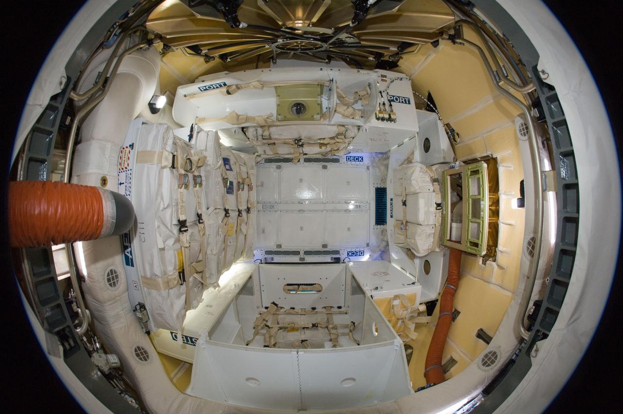 ISS031-E-077780 (26 May 2012) --- This “fisheye”  image of the inside of the SpaceX Dragon cargo craft was photographed  by an Expedition 31 crew  member aboard the International Space Station on May 26, 2012, the day after grapple. The SpaceX Falcon 9 and its Dragon spacecraft launched on Tuesday, May 22, at 3:44 a.m. EDT. This mission is a demonstration flight by Space Exploration Technologies, or SpaceX, as part of its contract with NASA to have private companies launch cargo safely to the International Space Station.