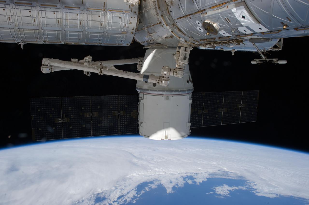 ISS031-E-079555 (30 May 2012) --- The SpaceX Dragon cargo craft is pictured during its final hours of being docked to the International Space Station. On May 31 it is scheduled to be released by the Canadaarm2 robotic arm and head toward a splashdown in the Pacific Ocean.