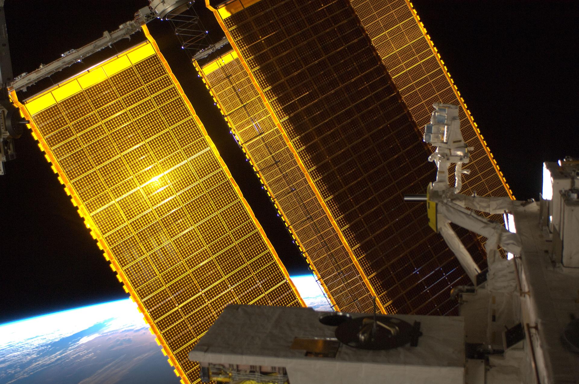 Solar array panels are featured in this image photographed by an Expedition 31 crew member on the International Space Station. Earth’s horizon and the blackness of space provide the backdrop for the scene.