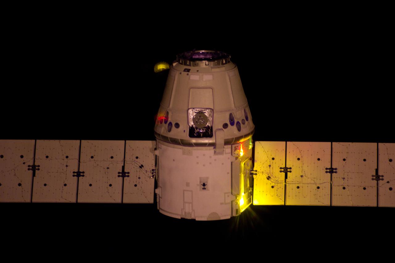 ISS031-E-084463 (25 May 2012) --- A vertical view from the International Space Station shows the relative approach of the orbital outpost and the SpaceX Dragon cargo craft prior to grapple by the Canadarm2 robotic arm, controlled by the Expedition 31 crew members.