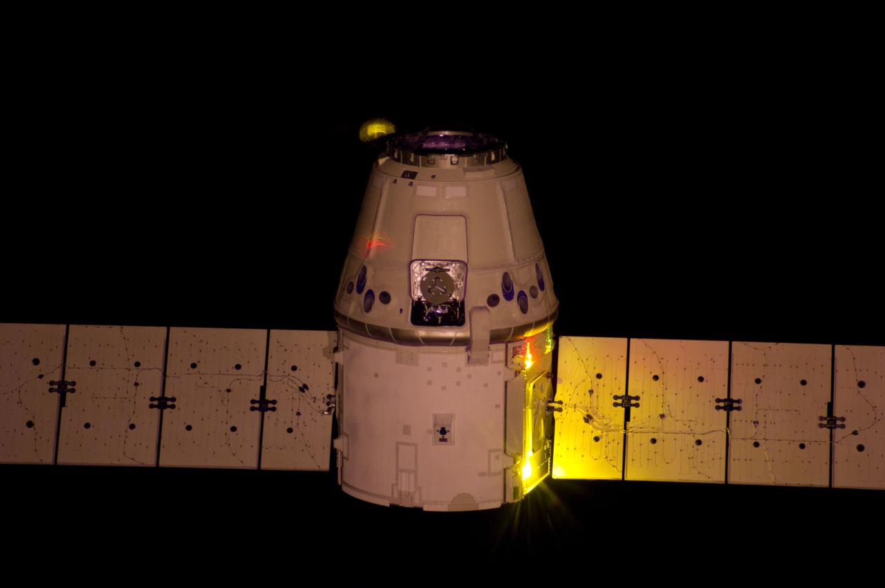 ISS031-E-084464 (25 May 2012) --- A vertical view from the International Space Station shows the relative approach of the orbital outpost and the SpaceX Dragon cargo craft prior to grapple by the Canadarm2 robotic arm, controlled by the Expedition 31 crew members.