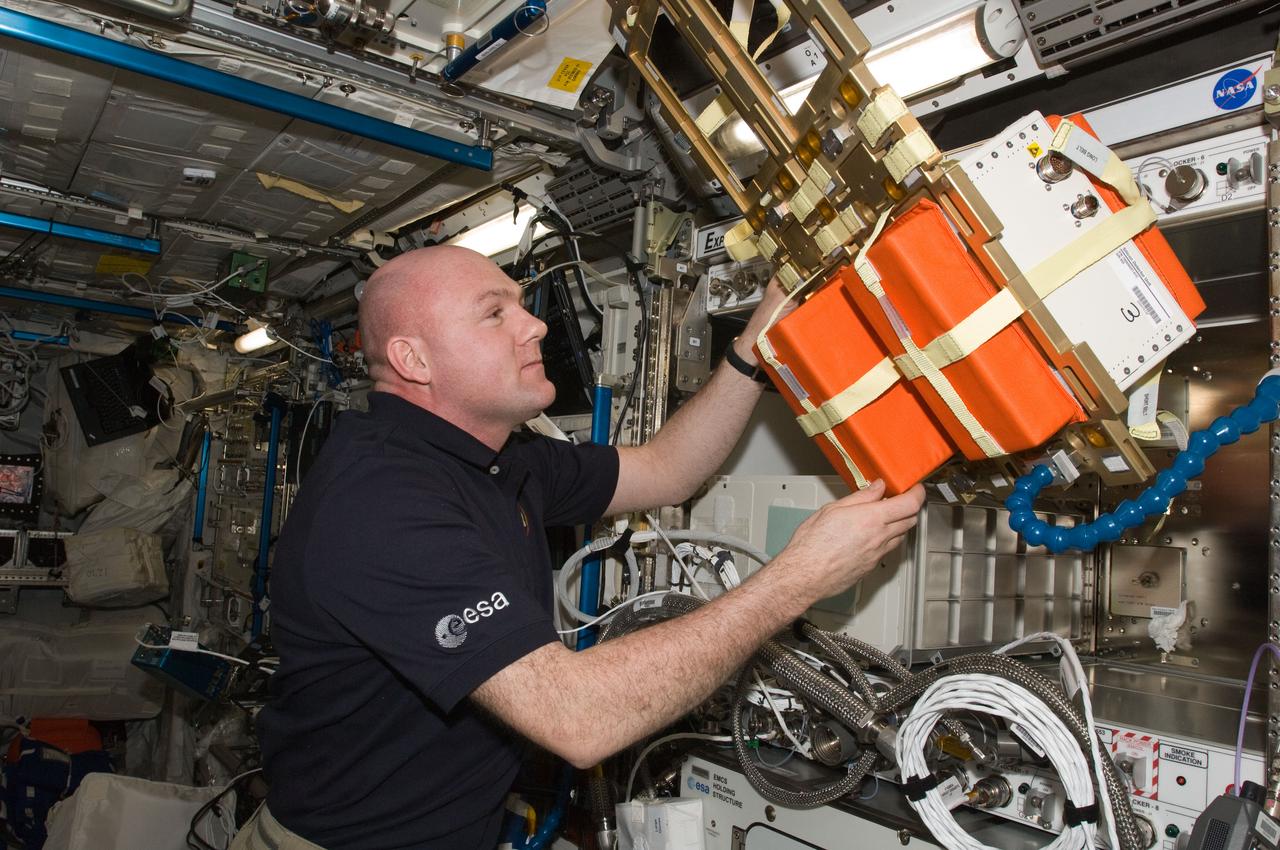 ISS031-E-096064 (8 June 2012) --- European Space Agency astronaut Andre Kuipers, Expedition 31 flight engineer, works with the silicon detector unit in the Columbus laboratory of the International Space Station.