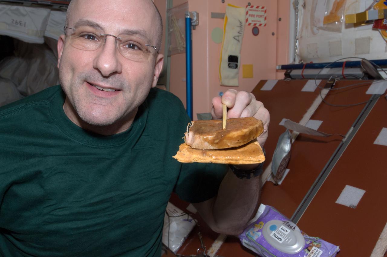 ISS031-E-134766 (16 June 2012) --- NASA astronaut Don Pettit, Expedition 31 flight engineer, holds a snack in the Unity node of the International Space Station.