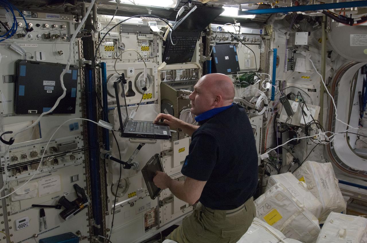 ISS031-E-140314 (18 May 2012) --- European Space Agency astronaut Andre Kuipers, Expedition 31 flight engineer, supports a ground-conducted health check on ESA’s Biolab Glovebox in the Columbus laboratory of the International Space Station.
