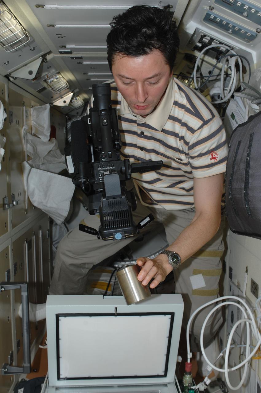 ISS031-E-140699 (23 June 2012) --- Russian cosmonaut Sergei Revin, Expedition 31 flight engineer, works on the BTKh-26 KASKAD (Cascade) experiment in the Rassvet Mini-Research Module 1 (MRM-1) of the International Space Station.