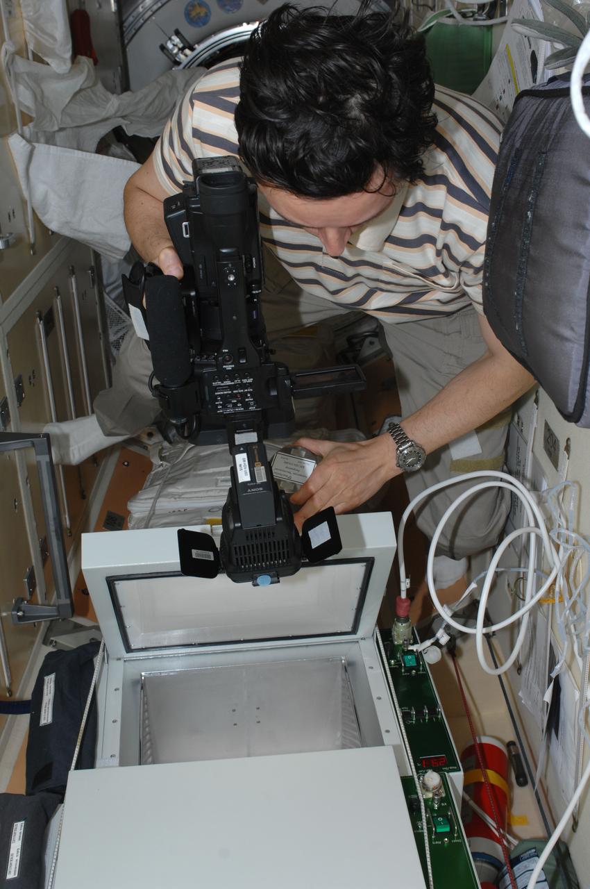 ISS031-E-140701 (23 June 2012) --- Russian cosmonaut Sergei Revin, Expedition 31 flight engineer, works on the BTKh-26 KASKAD (Cascade) experiment in the Rassvet Mini-Research Module 1 (MRM-1) of the International Space Station.