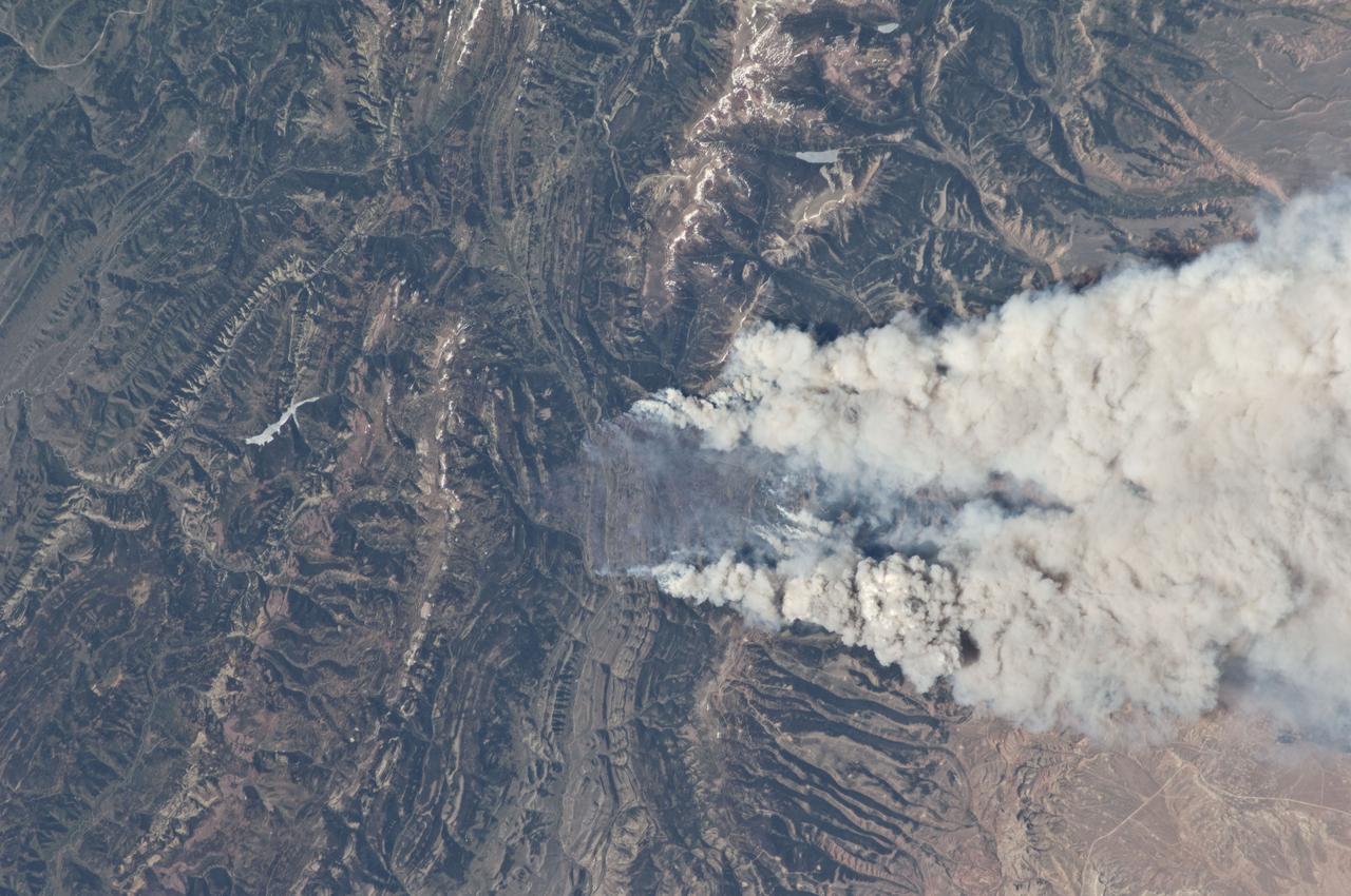 ISS031-E-146306 (27 June 2012) --- An Expedition 31 crew member aboard the International Space Station, flying approximately 240 miles (386 kilometers) above Earth, captured this view of the Fontenelle fire on June 27, 2012. The fire, burning in Wyoming 18 miles (29 kilometers) west of Big Piney, was discovered on June 24. [Editor?s  update ---  By the morning of June 28, the fire had burned 25,000 acres (101 square kilometers). By July 6, the area burned had more than doubled to 57,324 acres (232 square kilometers), and the fire was 25 percent contained].