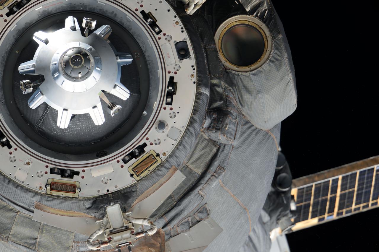 ISS032-E-005023 (1 July 2012) --- This close-up view shows the docking mechanism of the Soyuz TMA-03M spacecraft as it undocks from the International Space Station?s Rassvet Mini-Research Module 1 (MRM-1) on July 1, 2012. Russian cosmonaut Oleg Kononenko, Expedition 31 commander; along with European Space Agency astronaut Andre Kuipers and NASA astronaut Don Pettit, both flight engineers, are returning from more than six months aboard the space station where they served as members of the Expedition 30 and 31 crews.