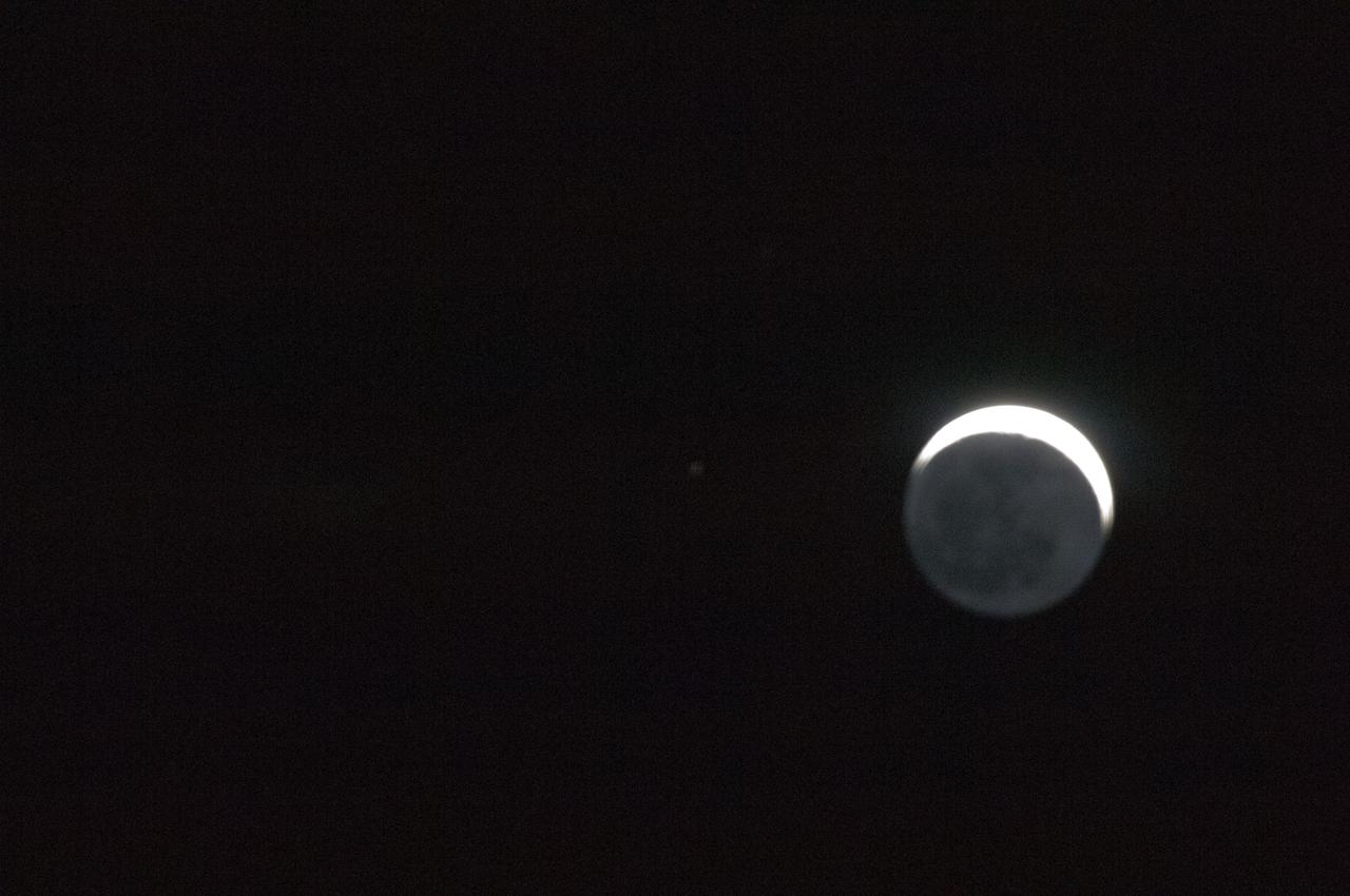 ISS032-E-008651 (21 July 2012) --- From over the Southern Indian Ocean about 155 miles (250 kilometers) northeast of Possession Island on July 21, 2012, one of the members of the Expedition 32 crew took this photo of the waxing crescent moon with 7 per cent of the moon?s visible disk illuminated, giving it an unusual appearance.