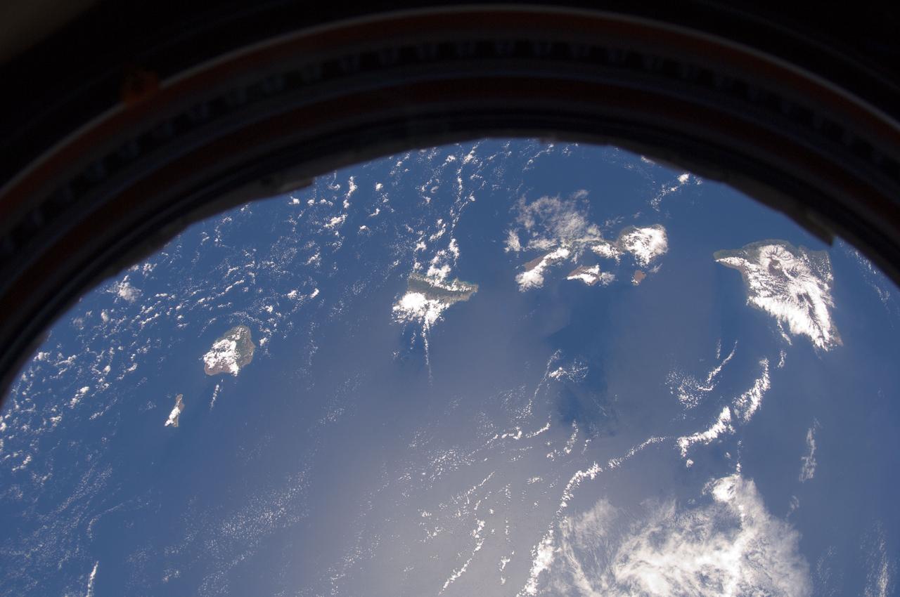ISS032-E-008931 (20 July 2012) --- This picture of the Hawaiian Island chain was photographed by one the Expedition 32 crew members aboard the International Space Station, flying approximately 240 miles above Earth on July 20.  The islands are,  from the left to right, Niihau, Kauai, Oahu, the cluster of Molokai, Lanai and Kahoolawe, Maui and the Big Island.