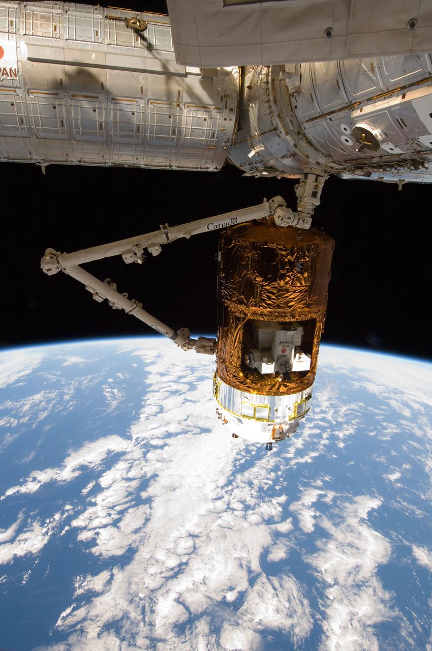 ISS032-E-010444 (27 July 2012) --- In the grasp of the International Space Station’s Canadarm2, the unpiloted Japan Aerospace Exploration Agency (JAXA) H-II Transfer Vehicle (HTV-3) is berthed to the Earth-facing port of the station's Harmony node. The attachment was completed at 10:34 a.m. (EDT) on July 27, 2012. Earth’s horizon and the blackness of space provide the backdrop for the scene.