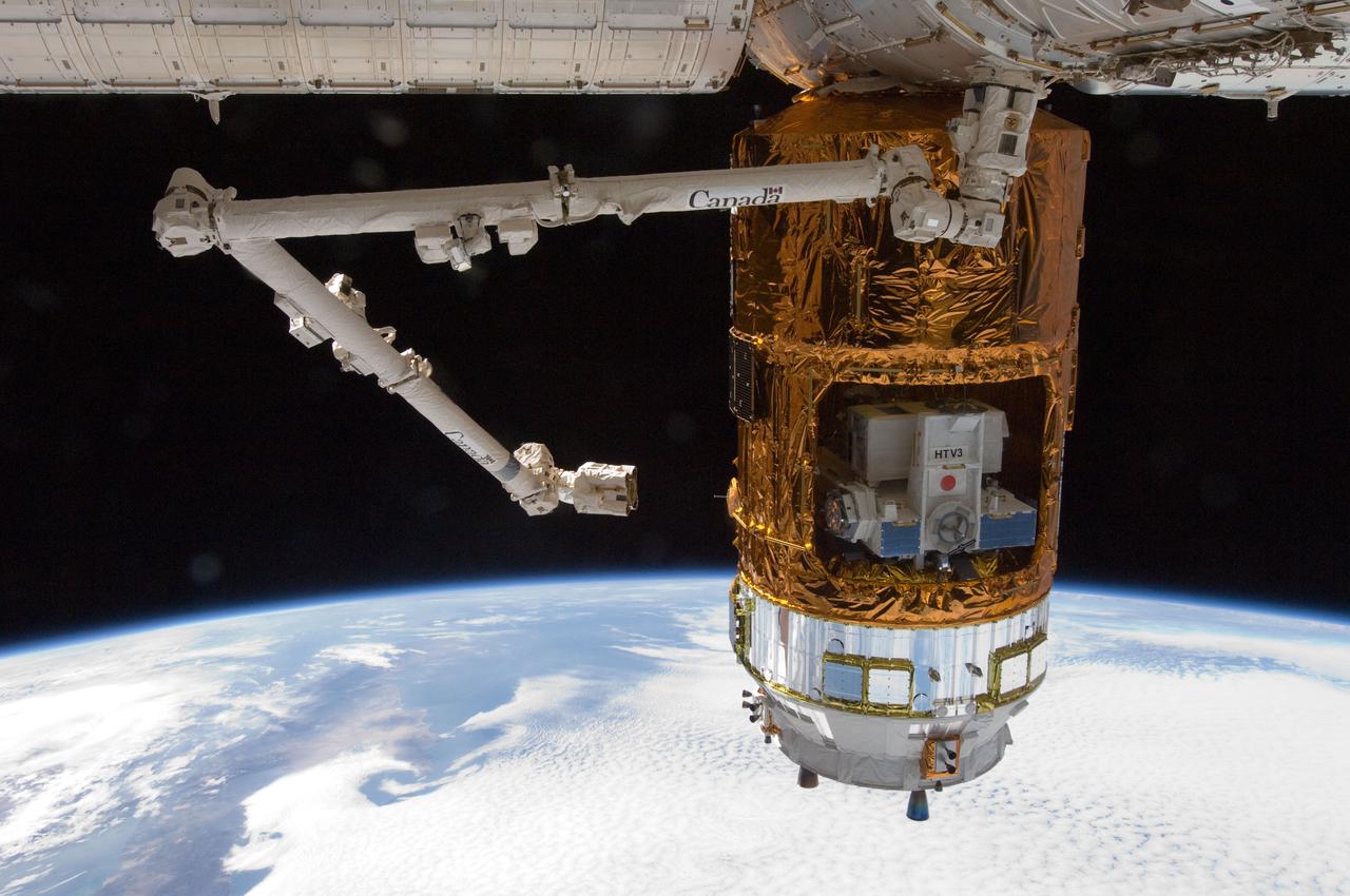 ISS032-E-010473 (27 July 2012) --- The unpiloted Japan Aerospace Exploration Agency (JAXA) H-II Transfer Vehicle (HTV-3) is featured in this image photographed by an Expedition 32 crew member shortly after the HTV-3 was berthed to the Earth-facing port of the International Space Station's Harmony node using the Canadarm2 robotic arm. The attachment was completed at 10:34 a.m. (EDT) on July 27, 2012. Earth?s horizon and the blackness of space provide the backdrop for the scene.