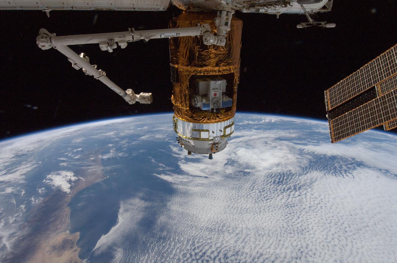 ISS032-E-010476 (27 July 2012) --- The unpiloted Japan Aerospace Exploration Agency (JAXA) H-II Transfer Vehicle (HTV-3) is featured in this image photographed by an Expedition 32 crew member shortly after the HTV-3 was berthed to the Earth-facing port of the International Space Station's Harmony node using the Canadarm2 robotic arm. The attachment was completed at 10:34 a.m. (EDT) on July 27, 2012. Earth?s horizon and the blackness of space provide the backdrop for the scene.