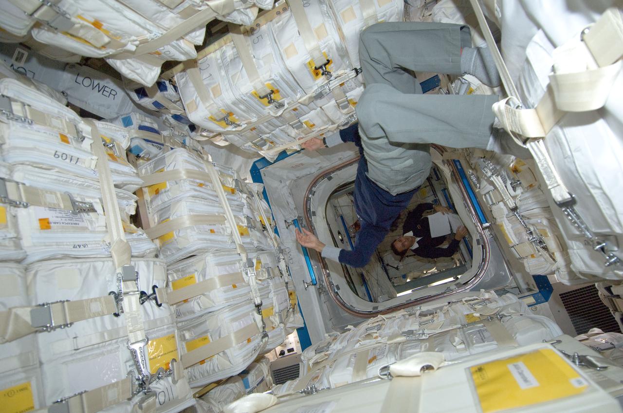 ISS032-E-011457 (28 July 2012) --- NASA astronaut Sunita Williams, Expedition 32 flight engineer, works in the newly attached Japan Aerospace Exploration Agency (JAXA) H-II Transfer Vehicle (HTV-3) docked to the International Space Station’s Harmony node. NASA astronaut Joe Acaba, flight engineer, is visible in the background.