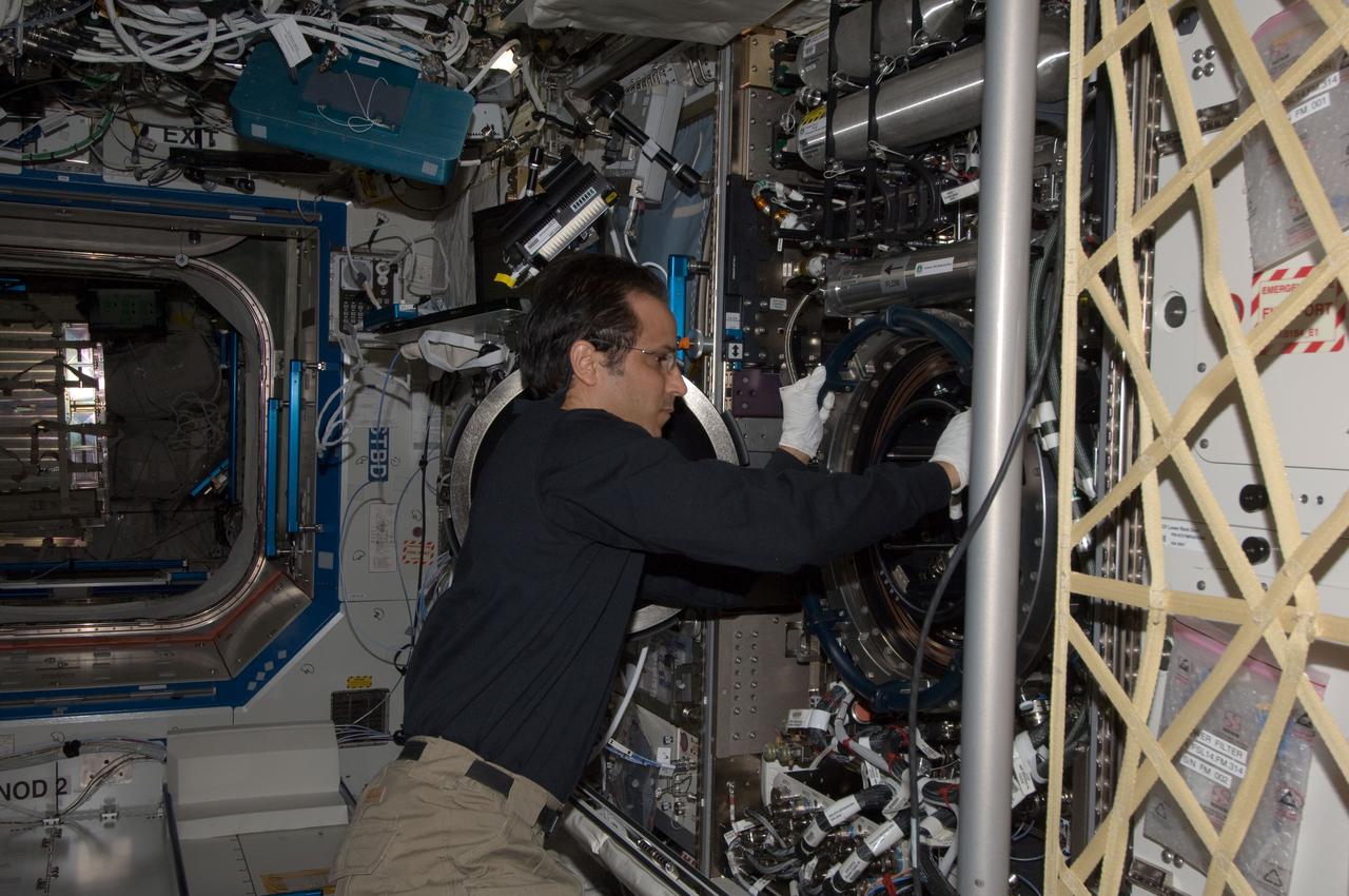 ISS032-E-014574 (7 Aug. 2012) --- NASA astronaut Joe Acaba, Expedition 32 flight engineer, works on the Combustion Integrated Rack (CIR) in the Destiny laboratory of the International Space Station.