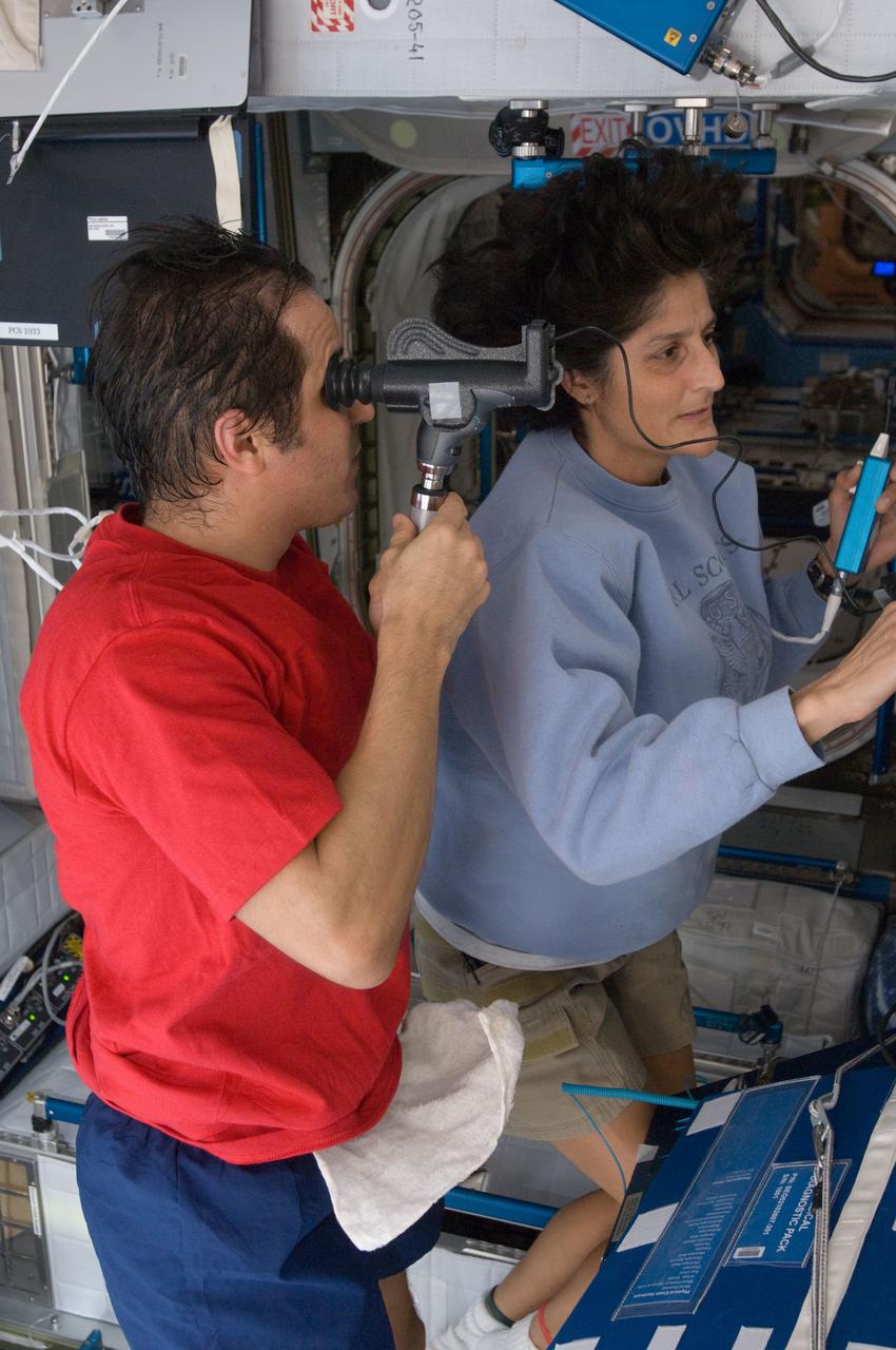 ISS032-E-018089 (15 Aug. 2012) --- NASA astronaut Joe Acaba, Expedition 32 flight engineer, performs the Health Maintenance System (HMS) Eye Exam - PanOptic in the Harmony node of the International Space Station. NASA astronaut Sunita Williams, flight engineer, assisted Acaba.