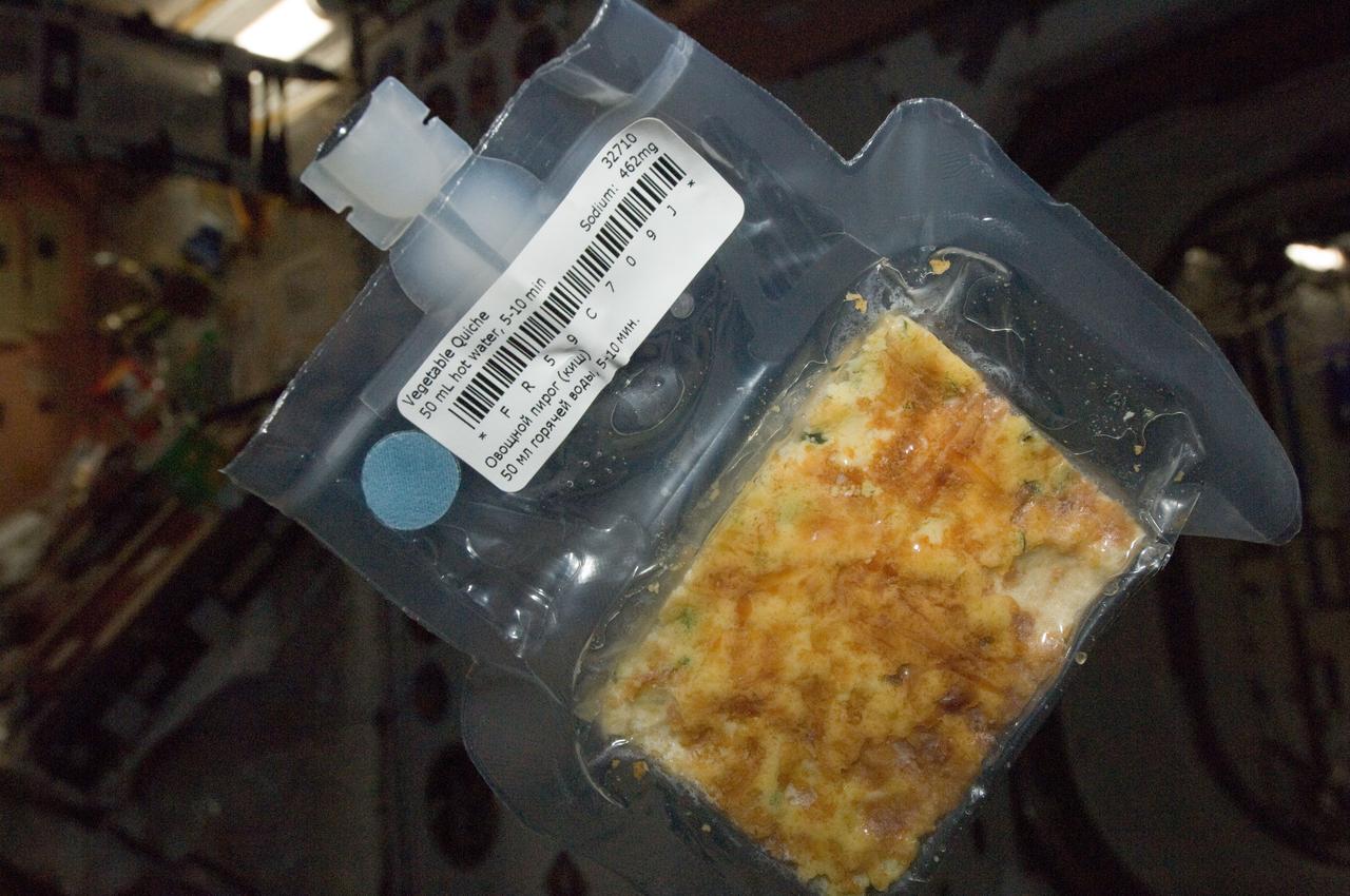 ISS032-E-019019 (12 Aug. 2012) --- A package of vegetable quiche is featured in this image photographed by an Expedition 32 crew member on the International Space Station.