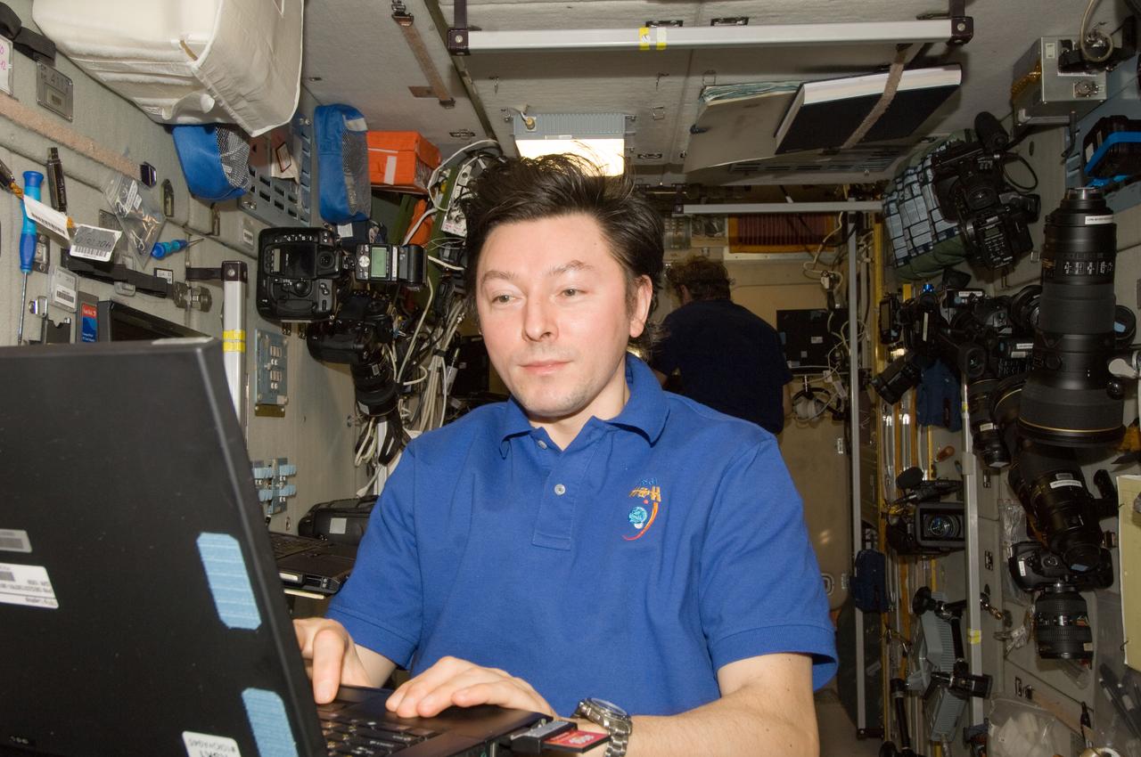 ISS032-E-019041 (16 Aug. 2012) --- Russian cosmonaut Sergei Revin, Expedition 32 flight engineer, uses a computer in the Zvezda Service Module of the International Space Station.