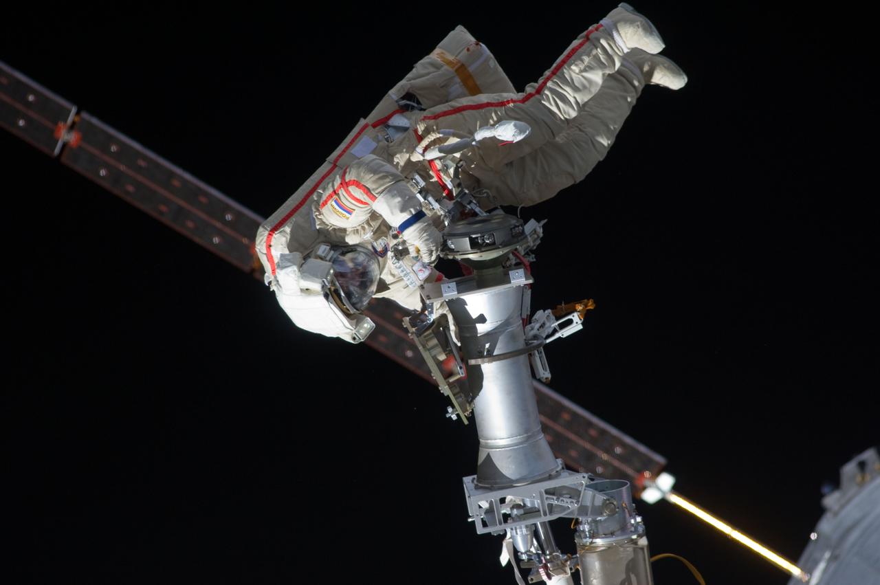 ISS032-E-021085 (20 Aug. 2012) --- Russian cosmonaut Gennady Padalka, Expedition 32 commander, participates in a session of extravehicular activity (EVA) to continue outfitting the International Space Station. During the five-hour, 51-minute spacewalk, Padalka and Russian cosmonaut Yuri Malenchenko (out of frame), flight engineer, moved the Strela-2 cargo boom from the Pirs docking compartment to the Zarya module to prepare Pirs for its eventual replacement with a new Russian multipurpose laboratory module. The two spacewalking cosmonauts also installed micrometeoroid debris shields on the exterior of the Zvezda service module and deployed a small science satellite.