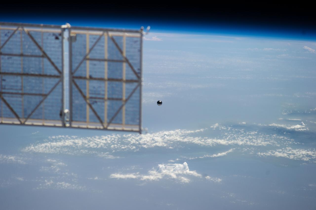 ISS032-E-021087 (20 Aug. 2012) --- A small ball-shaped science satellite is featured in this image photographed by an Expedition 32 crew member after its deployment during a session of extravehicular activity (EVA). Earth?s horizon and the blackness of space provide the backdrop for the scene.