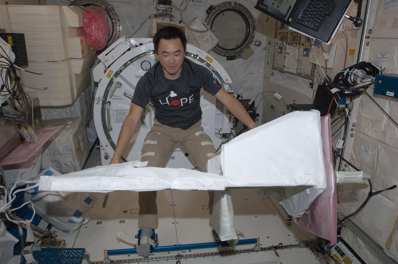 ISS032-E-022175 (21 Aug. 2012) --- Japan Aerospace Exploration Agency astronaut Aki Hoshide, Expedition 32 flight engineer, assembles the JEM Robotic Maneuvering System Multi-Purpose Experiment Platform (JEMRMS MPEP) in the Kibo laboratory of the International Space Station.