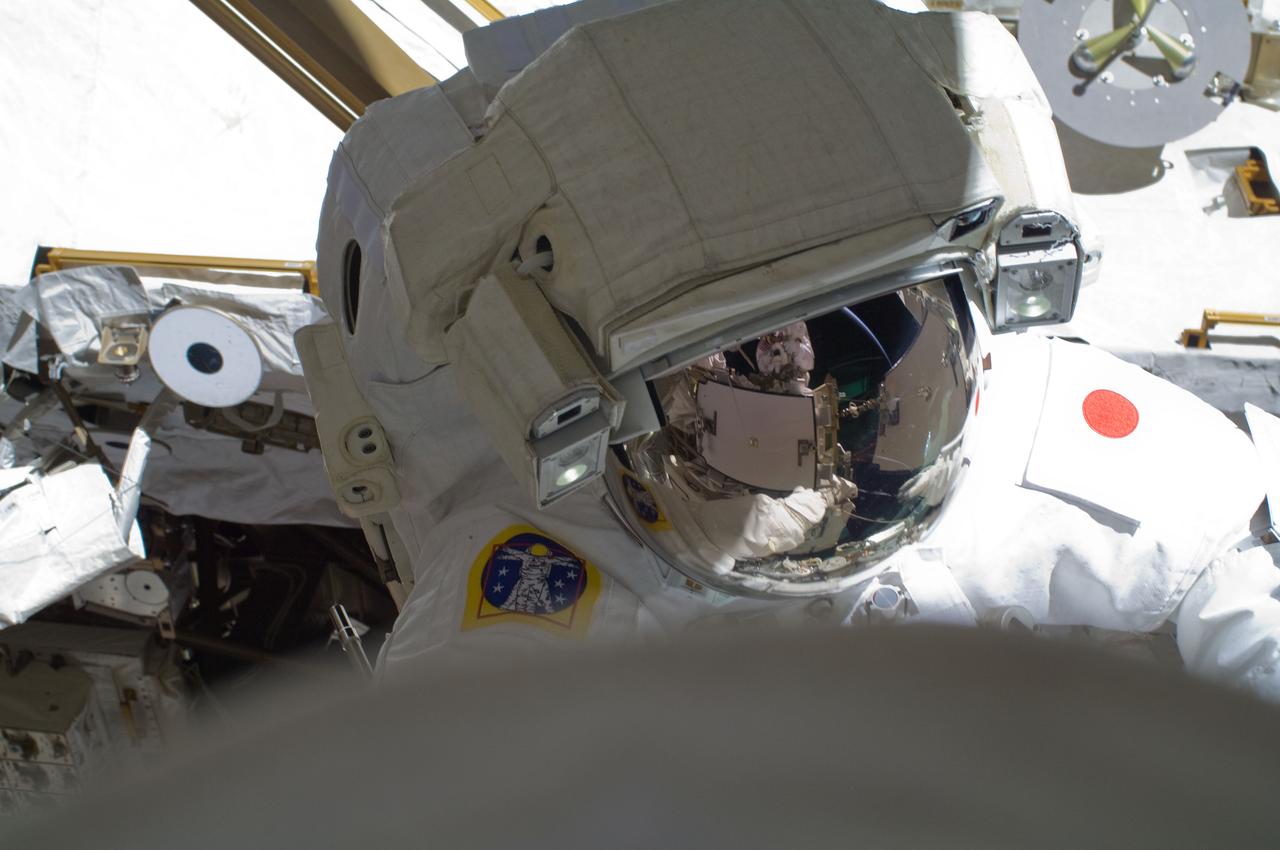 ISS032-E-024222 (30 Aug. 2012) --- Japan Aerospace Exploration Agency astronaut Aki Hoshide and NASA astronaut Sunita Williams (out of frame), both Expedition 32 flight engineers, participate in a session of extravehicular activity (EVA) to continue outfitting the International Space Station.
