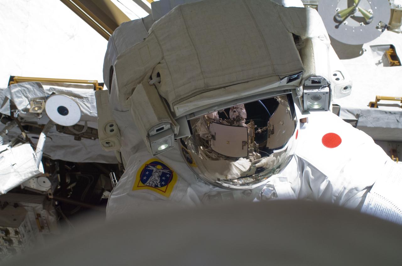 ISS032-E-024223 (30 Aug. 2012) --- Japan Aerospace Exploration Agency astronaut Aki Hoshide and NASA astronaut Sunita Williams (out of frame), both Expedition 32 flight engineers, participate in a session of extravehicular activity (EVA) to continue outfitting the International Space Station.