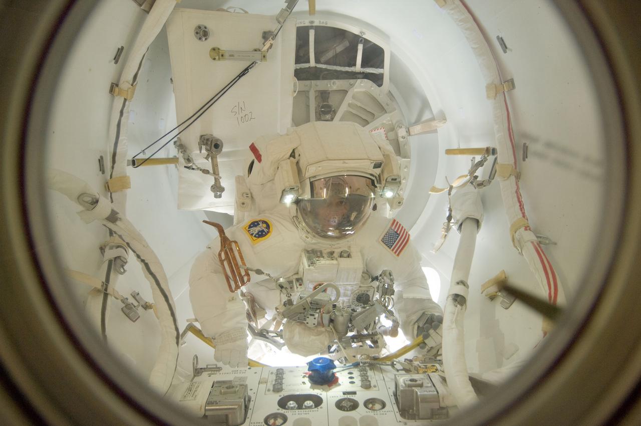 ISS032-E-024428 (30 Aug. 2012) --- NASA astronaut Sunita Williams, flight engineer, exits the International Space Station's Quest airlock to begin a session of extravehicular activity (EVA) for the Expedition 32 mission. Japan Aerospace Exploration Agency astronaut Aki Hoshide, flight engineer, joined Williams on the spacewalk.