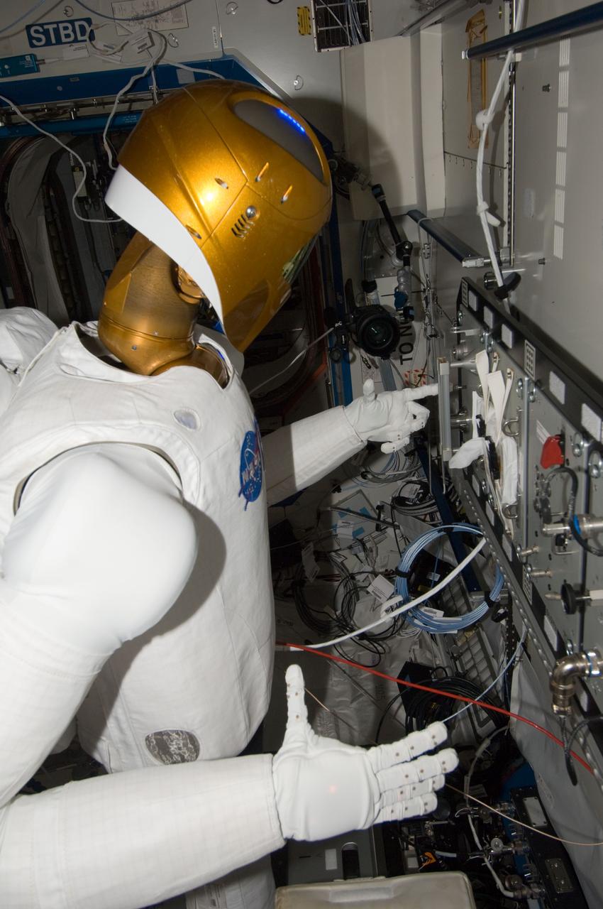 ISS032-E-024548 (28 Aug. 2012) --- Robonaut 2 humanoid robot prepares to grasp a handrail during another system checkout in the Destiny laboratory of the International Space Station.