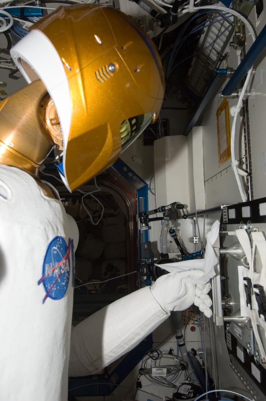 ISS032-E-024561 (28 Aug. 2012) --- Robonaut 2 humanoid robot prepares to grasp a handrail during another system checkout in the Destiny laboratory of the International Space Station.