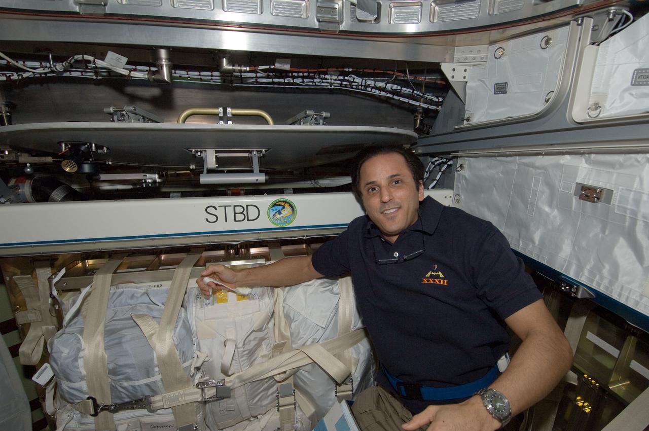 ISS032-E-026315 (10 Sept. 2012) --- Expedition 32 Flight Engineer Joe Acaba,  NASA astronaut, pauses for a photo while loading cargo into the H-II Transfer Vehicle (HTV-3) in preparation for its impending undocking from the International Space Station.