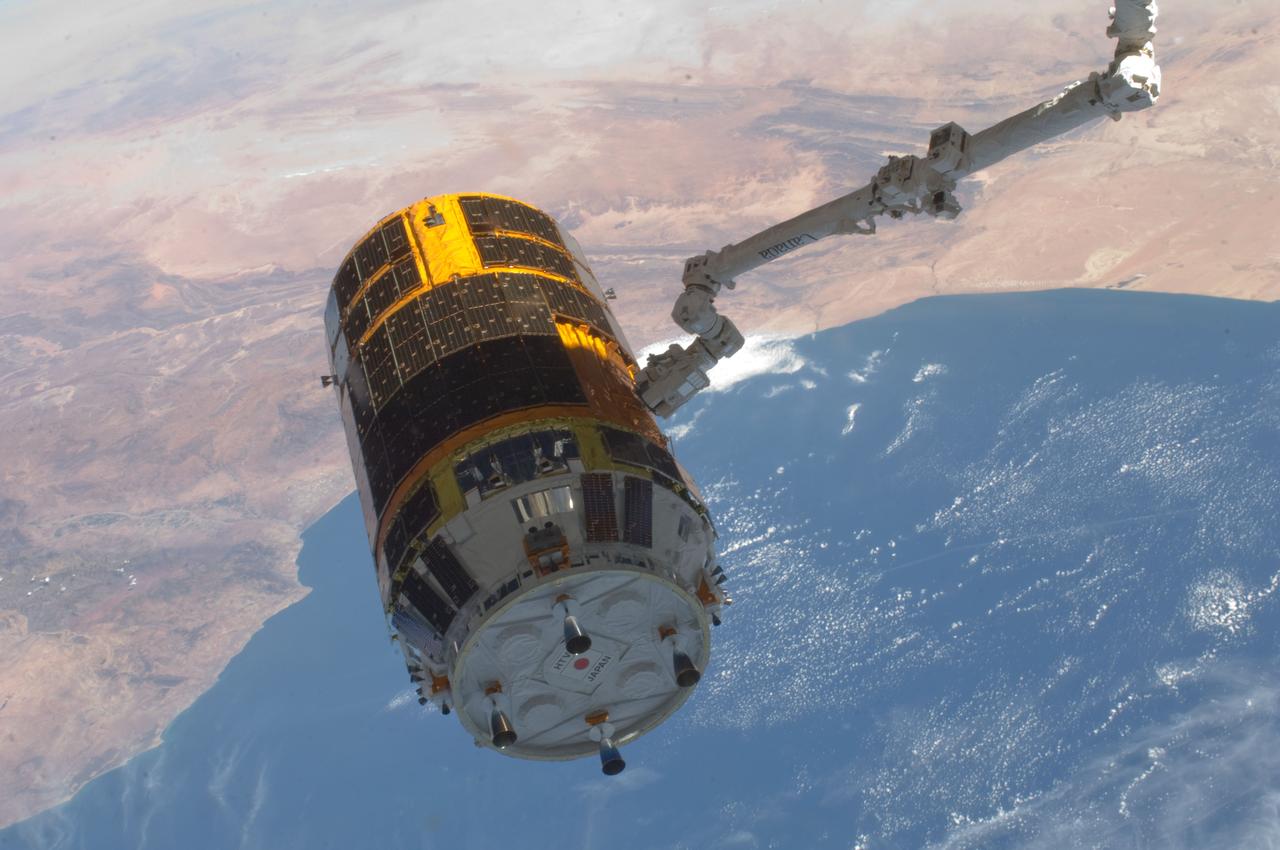 ISS032-E-026883 (12 Sept. 2012) --- With an oblique view of the southwest coast of Morocco serving as a backdrop, the International Space Station's Canadarm2 grasps the unpiloted Japan Aerospace Exploration Agency (JAXA) H-II Transfer Vehicle (HTV-3), filled with trash and unneeded items, in preparation for its release from the station. JAXA astronaut Aki Hoshide and NASA astronaut Joe Acaba, both Expedition 32 flight engineers, used the station's robot arm to grapple the HTV-3 and undock it from the Earth-facing port of the Harmony node. The cargo craft was released at 11:50 a.m. (EDT) on Sept. 12, 2012.  Cape Rhir and port city of Agadir are at lower left and part of the Anti-Atlas mountain range can be seen just inland.