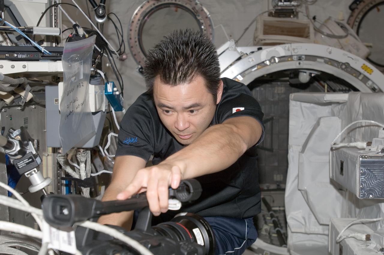 ISS033-E-006438 (21 Sept. 2012) --- In the International Space Station’s Kibo laboratory, Japan Aerospace Exploration Agency astronaut Aki Hoshide, Expedition 33 flight engineer, sets up a video camcorder in support of a ground checkout of the Small Satellite Orbital Deployer (SSOD) installed on the Multi-Purpose Experiment Platform (MPEP) of the extended slide table of the Kibo airlock.