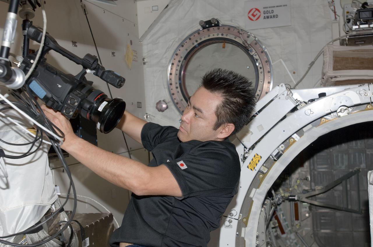ISS033-E-006439 (21 Sept. 2012) --- In the International Space Station’s Kibo laboratory, Japan Aerospace Exploration Agency astronaut Aki Hoshide, Expedition 33 flight engineer, sets up a video camcorder in support of a ground checkout of the Small Satellite Orbital Deployer (SSOD) installed on the Multi-Purpose Experiment Platform (MPEP) of the extended slide table of the Kibo airlock.