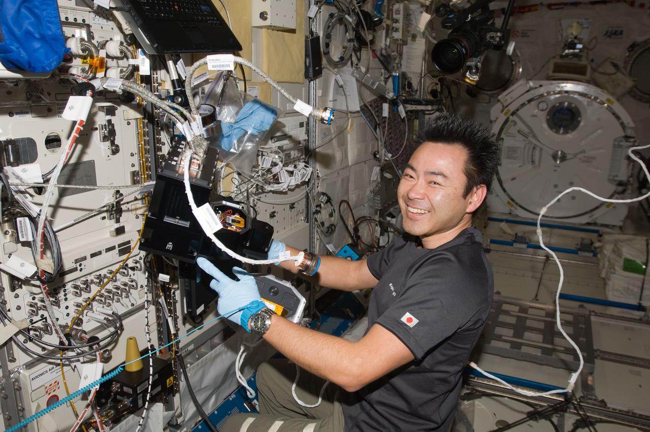 ISS033-E-007358 (25 Sept. 2012) --- Japan Aerospace Exploration Agency astronaut Aki Hoshide, Expedition 33 flight engineer, services the Nano Step payload in the Kibo laboratory of the International Space Station.