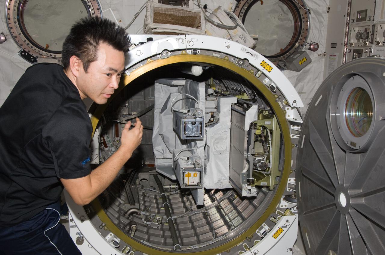 ISS033-E-007429 (26 Sept. 2012) --- Japan Aerospace Exploration Agency astronaut Aki Hoshide, Expedition 33 flight engineer, works near the airlock in the Kibo laboratory of the International Space Station. The Small Satellite Orbital Deployer (SSOD) previously installed on the Multi-Purpose Experiment Platform (MPEP) is visible in the airlock.