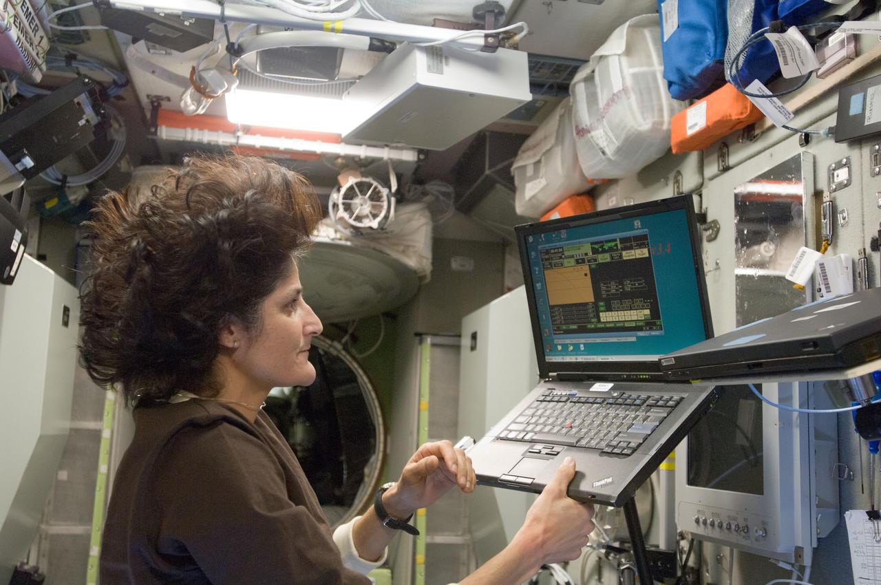 ISS033-E-008086 (28 Sept. 2012) --- In the International Space Station’s Zvezda Service Module, NASA astronaut Sunita Williams, Expedition 33 commander, uses a computer during an onboard training session for the standard Soyuz emergency descent drill, a regular procedure for each station crew.
