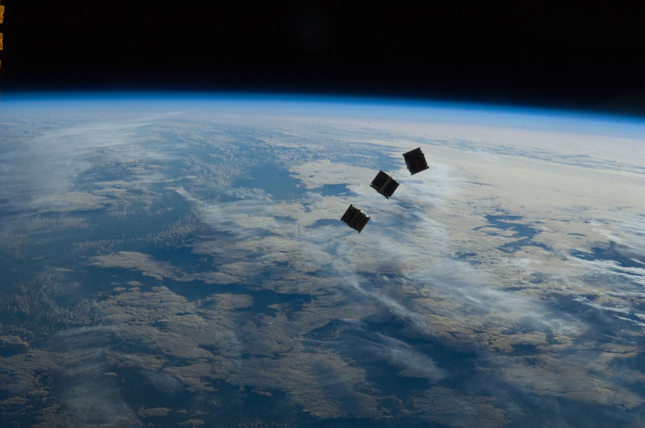 ISS033-E-009282 (4 Oct. 2012) --- Several tiny satellites are featured in this image photographed by an Expedition 33 crew member on the International Space Station. The satellites were released outside the Kibo laboratory using a Small Satellite Orbital Deployer attached to the Japanese module’s robotic arm on Oct. 4, 2012. Japan Aerospace Exploration Agency astronaut Aki Hoshide, flight engineer, set up the satellite deployment gear inside the lab and placed it in the Kibo airlock. The Japanese robotic arm then grappled the deployment system and its satellites from the airlock for deployment. Earth’s horizon and the blackness of space provide the backdrop for the scene.